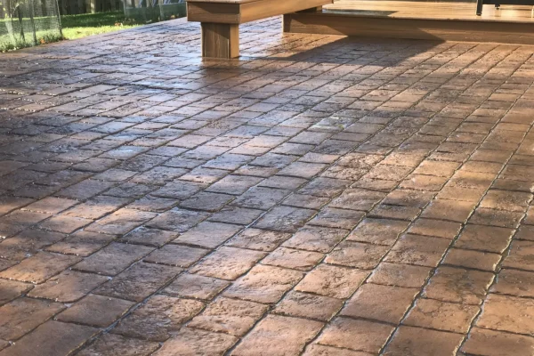 Stamped concrete patio with outdoor seating area – Concrete Construction