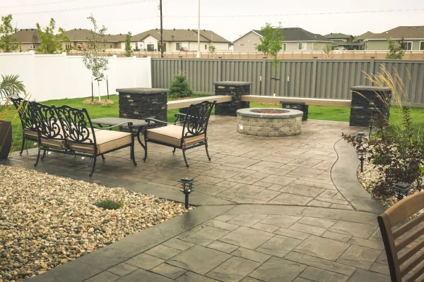 Stamped concrete patio with outdoor seating – Concrete Construction