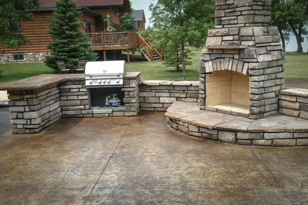 Outdoor kitchen with stone and concrete counters – Concrete Construction