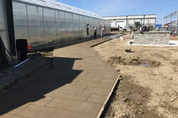 Large concrete sidewalk and outdoor workspace – Concrete Construction