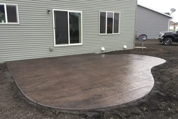 Decorative stamped patio in progress – Concrete Construction