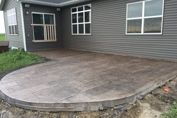 Decorative stamped patio in progress – Concrete Construction