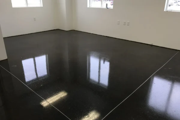 Polished black decorative concrete floor indoors – Concrete Construction