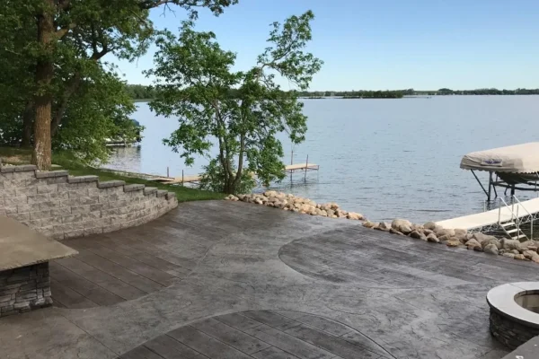 Stamped concrete patio with view of lake – Concrete Construction
