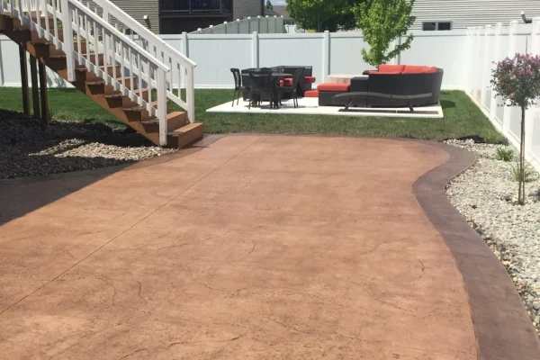 Backyard stamped concrete patio installation – Concrete Construction